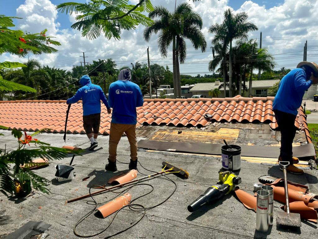 Clarity Roofing crew performing a full roof replacement in South Florida