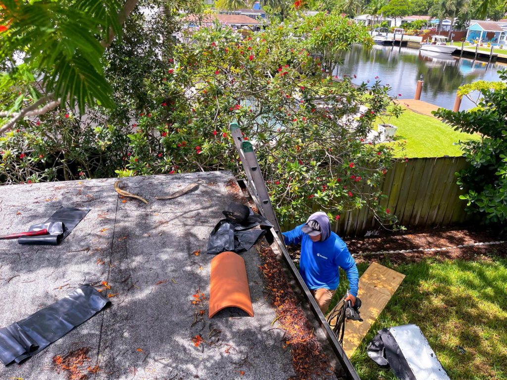 Clarity Roofing technician performing a waterfront roof repair in South Florida
